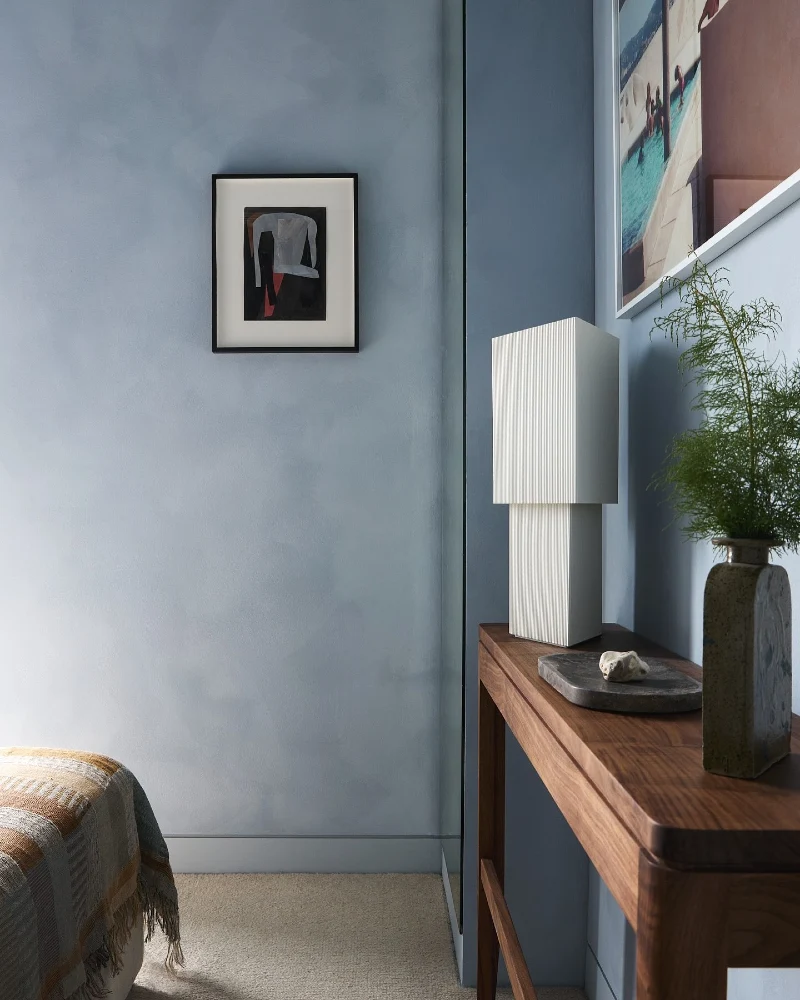 Blue Plaster Wall with Warm Walnut Console