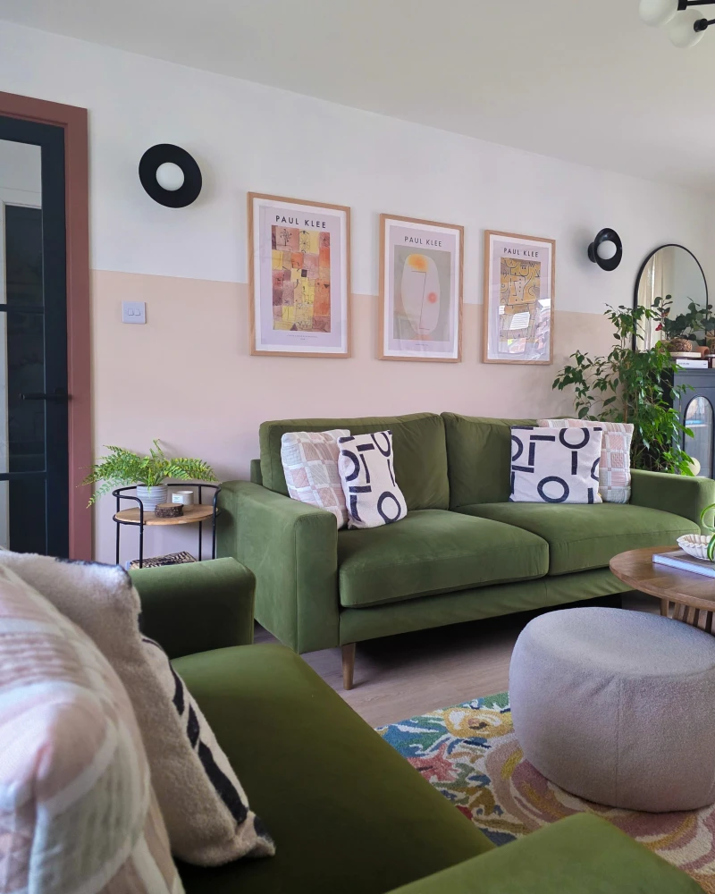 Blush Pink and Crisp White Split Wall with Olive Velvet Sofas and Graphic Art Prints