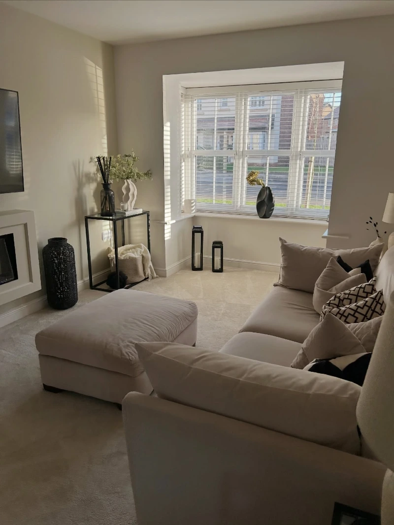 Bright Bay Window Nook with Slim Metal Console and Black Accents
