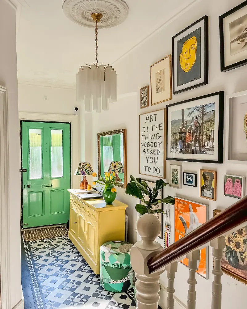 Bright Yellow Credenza with Eclectic Salon Gallery Wall and Mint Green Entry Door