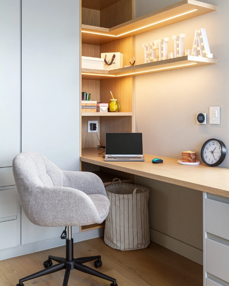 Built In Corner Desk with Oak Shelving and Warm LED Accent Lighting