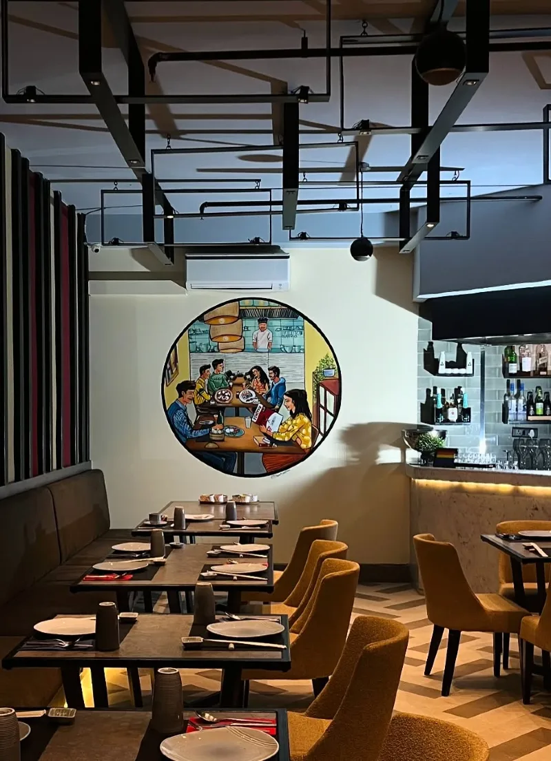 Circular wall mural with illustrated dining scene framed by vertical striped paneling
