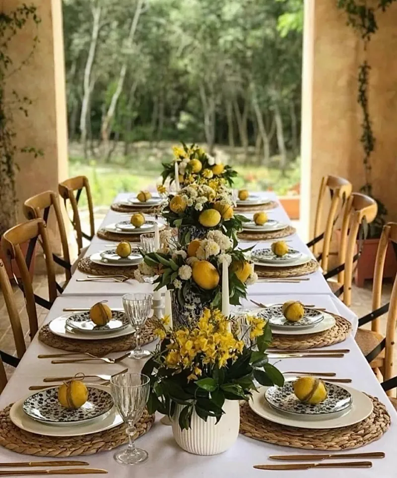 Citrus-Inspired Table with Woven Chargers and Blue-and-White Ceramic Accents