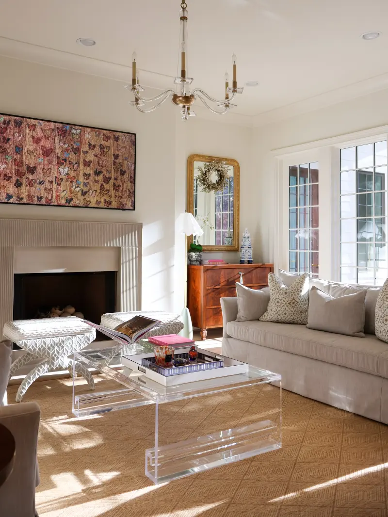 Clear Acrylic Coffee Table with Fluted Fireplace Mantel and Woven Sisal Rug