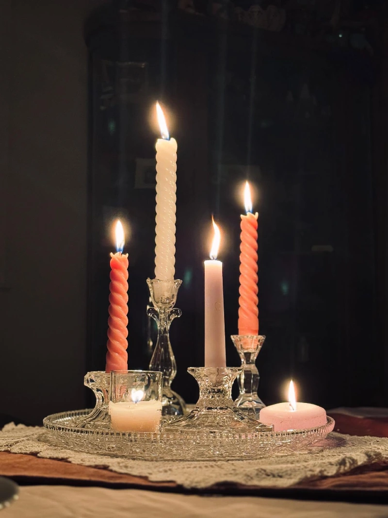 Clear Cut-Glass Candlesticks with Pastel Twisted Taper Candles on a Crystal Tray