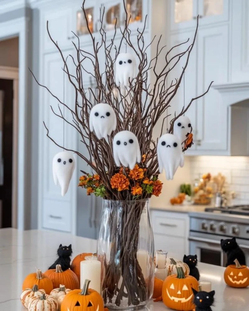 Clear Glass Vase with Twisted Branches, Hanging Felt Ghosts, and Festive Countertop Pumpkins