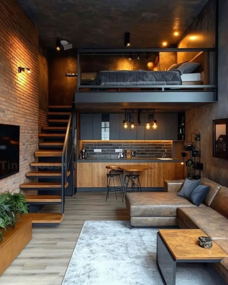Cognac Leather Sectional and Floating Wooden Stairs Against Exposed Brick