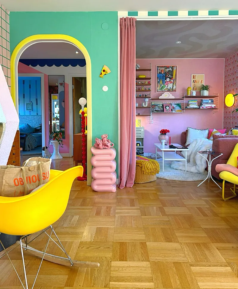 Color-Blocked Transition Space with Pink Curtain and Vibrant Archway
