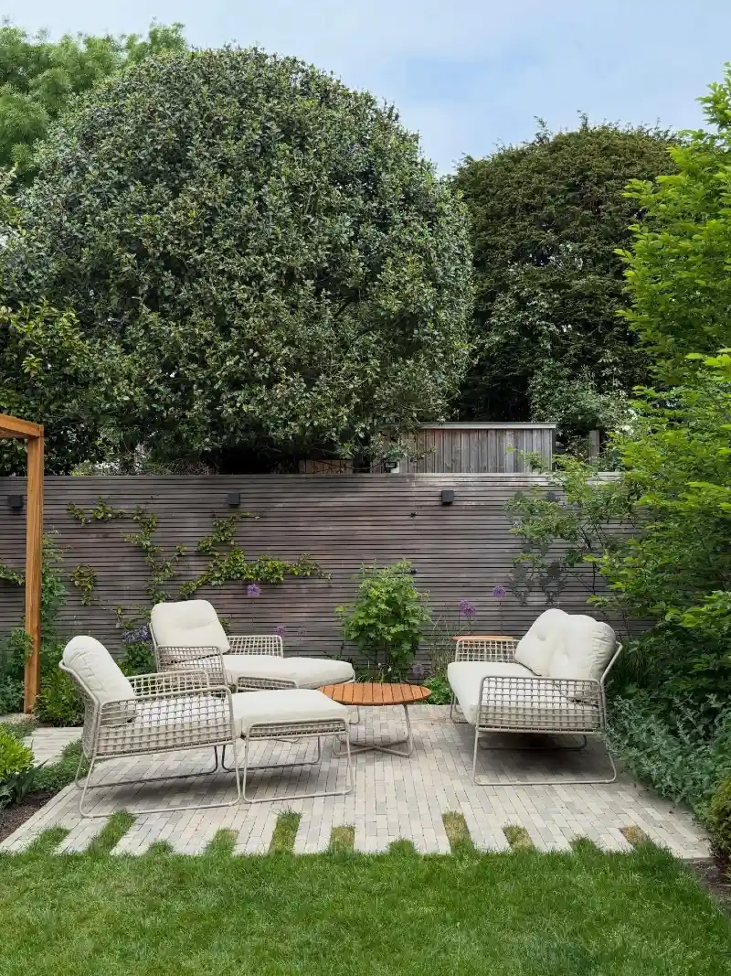 Contemporary Patio Lounge with Low Woven Seating and Horizontal Privacy Screen