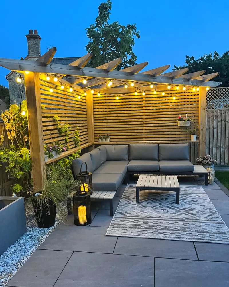 Corner Pergola with Horizontal Slat Screens and Café Lights