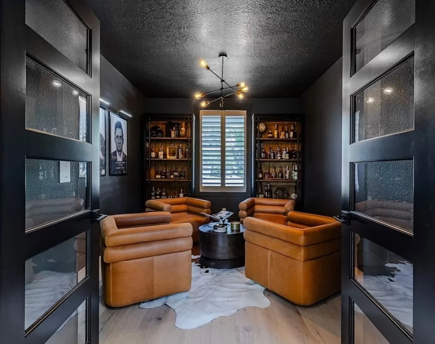 Cowhide Rug Snug with Iron Sputnik Chandelier