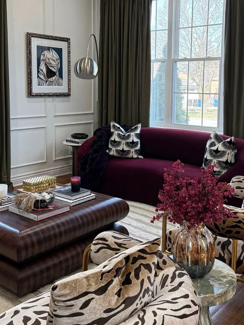 Curved Burgundy Velvet Sofa with Patterned Accents