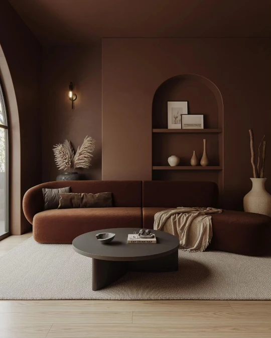 Curved Seating Softens Monochromatic Brown Walls
