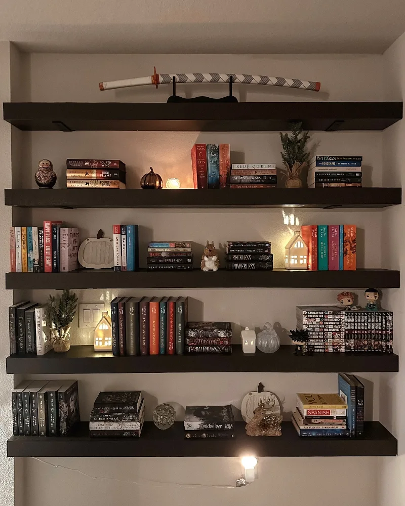 Dark Floating Shelving with Thematic Collectibles and Ambient Lighting