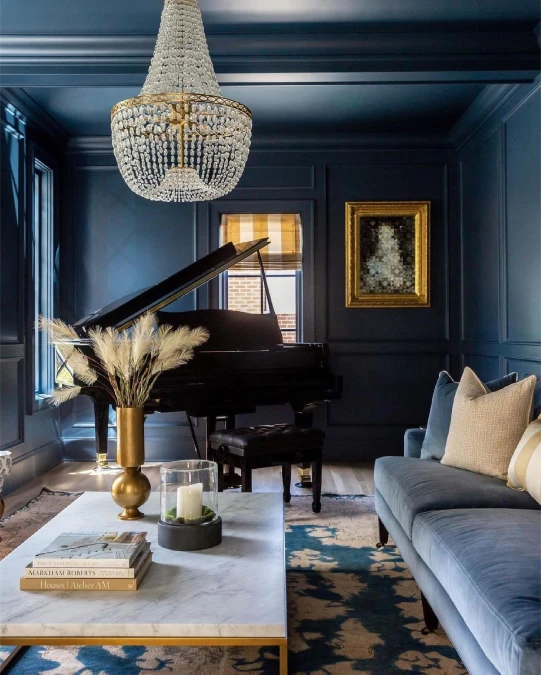 Dark Navy Paneling And Crystal Lighting