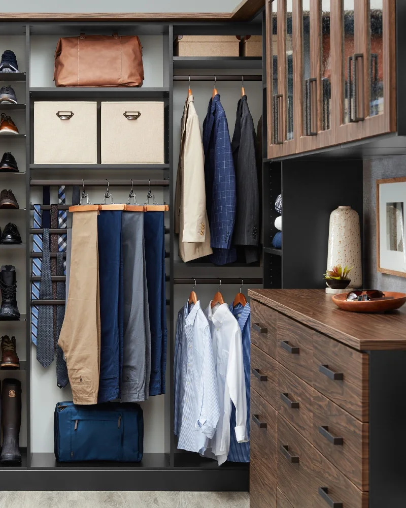 Dark Wood Cabinetry with Integrated Trouser Racks and Fabric Bins