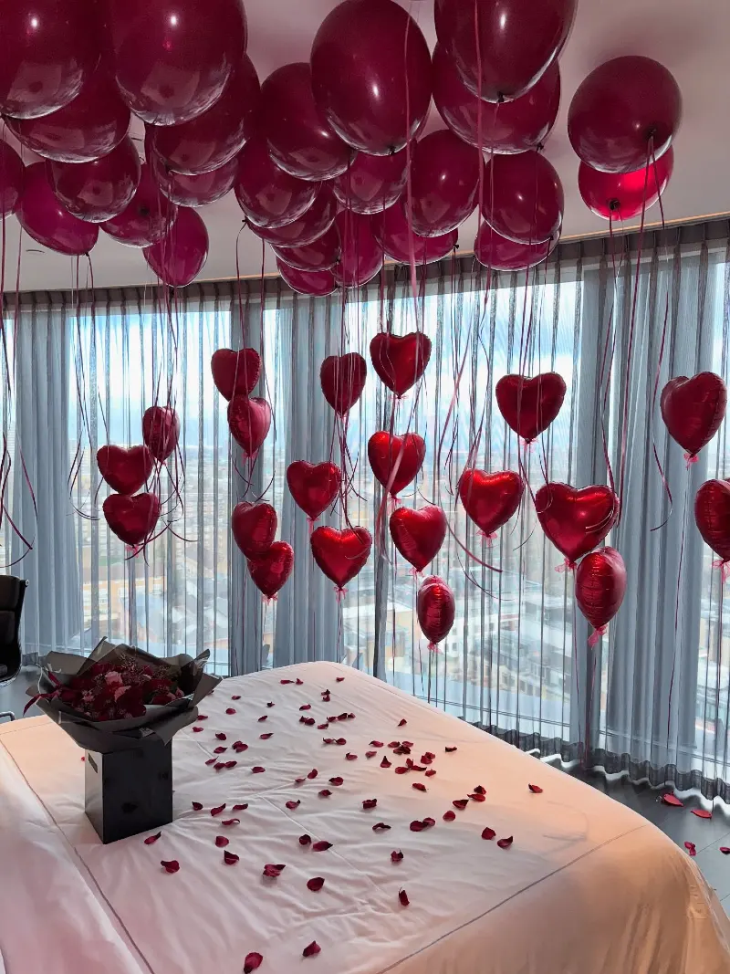 Deep Burgundy Ceiling Balloons with Hanging Foil Hearts and Black Bouquet Box