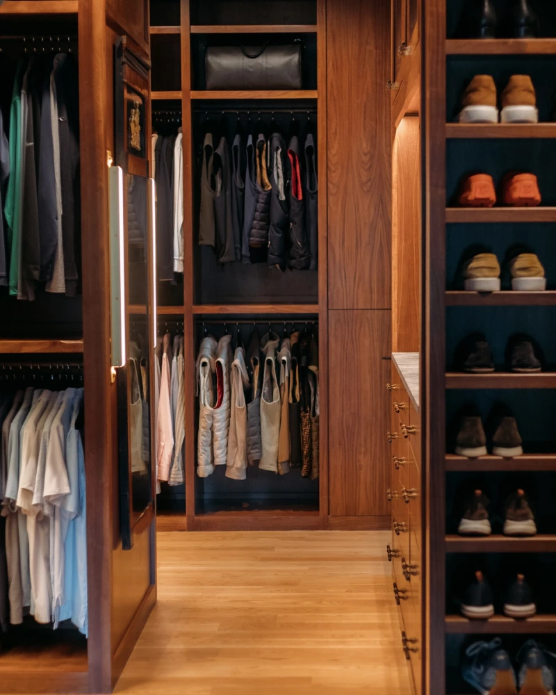 Deep Walnut Millwork with Vertical LED Mirror and Stacked Footwear Shelves
