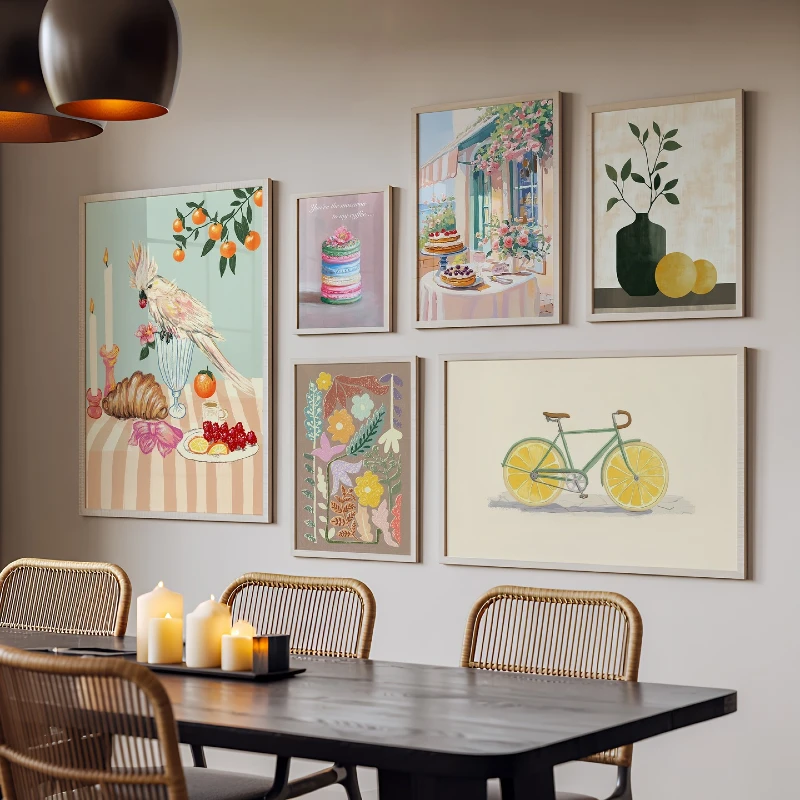 Dining Room Gallery Wall with Playful Illustrative Art, Woven Rattan Chairs, and Pillar Candles