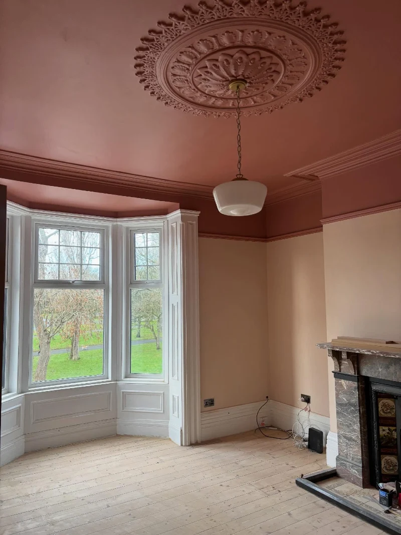 Dusty Rose Ceiling and Matching Ornate Plaster Medallion with Light Peach Walls