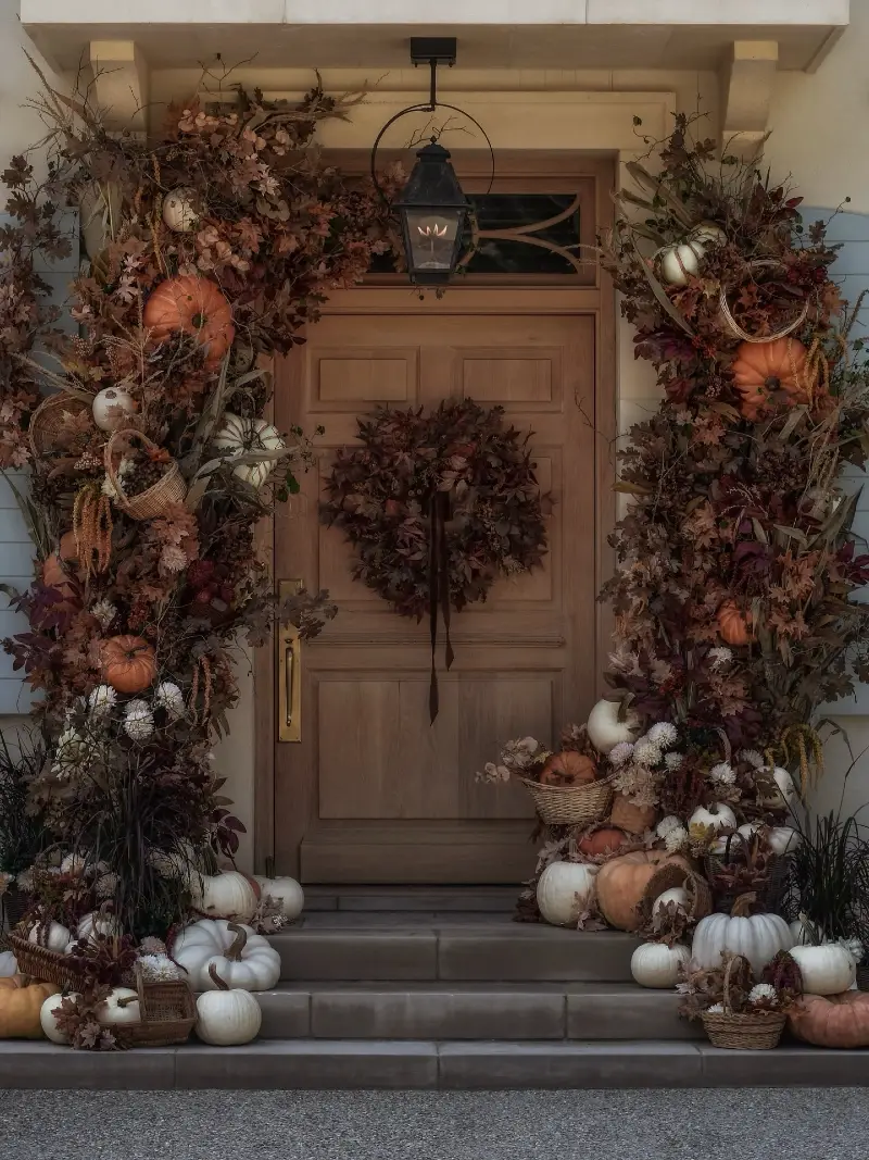 Elaborate Dried Foliage Archway with Assorted Pumpkins, Woven Baskets, and a Centerpiece Leaf Wreath