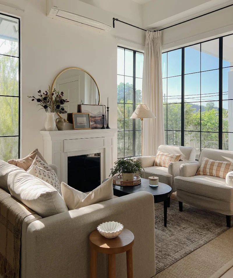 Fireplace Seating with Twin Armchairs and Tall Corner Windows