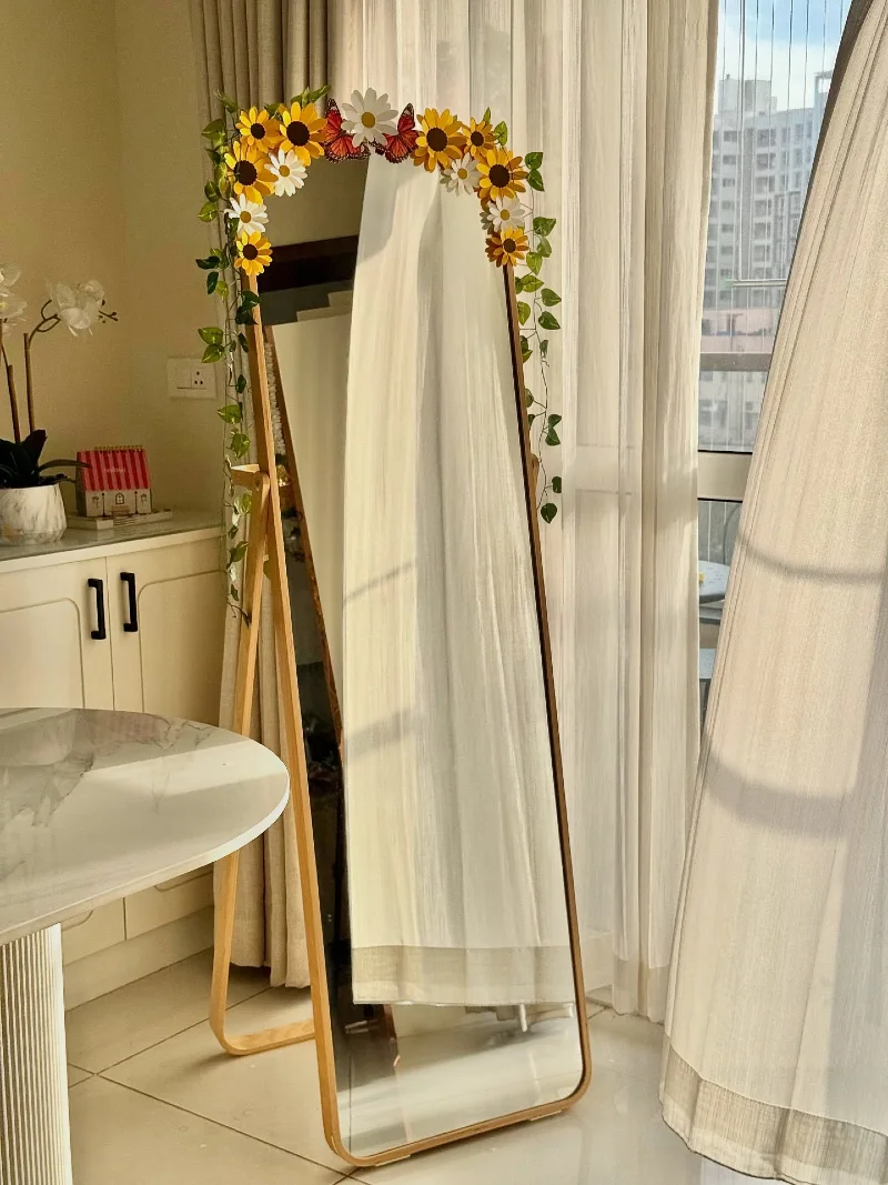 Floor Mirror Adorned with Faux Sunflowers and Vining Greenery
