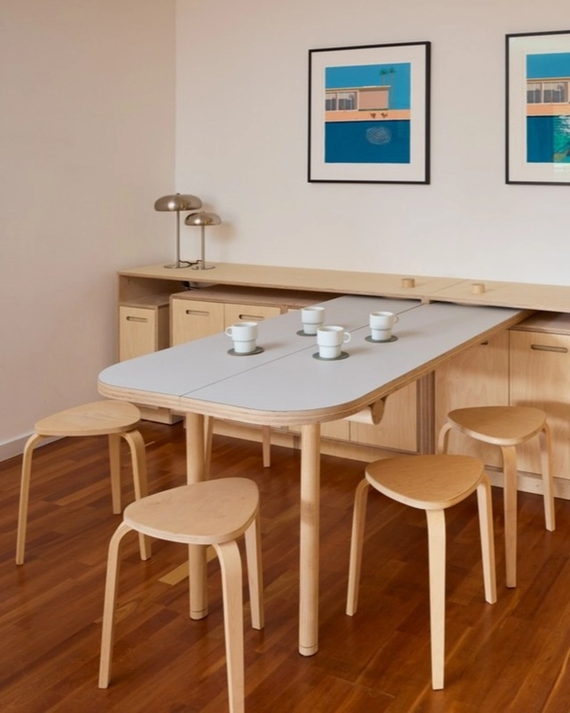 Foldout Dining Table Built into a Low Storage Cabinet