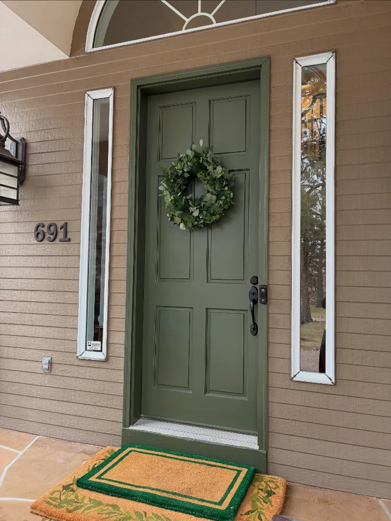 Forest Green Front Door with Eucalyptus Wreath and Black Hardware