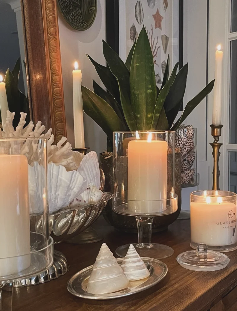 Glass Hurricane Pedestals with Coastal Seashells, Coral Bowls, and Tall Brass Tapers