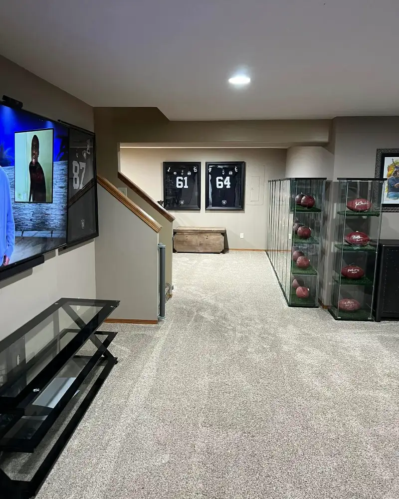 Glass Trophy Cabinets with Framed Black Football Jerseys
