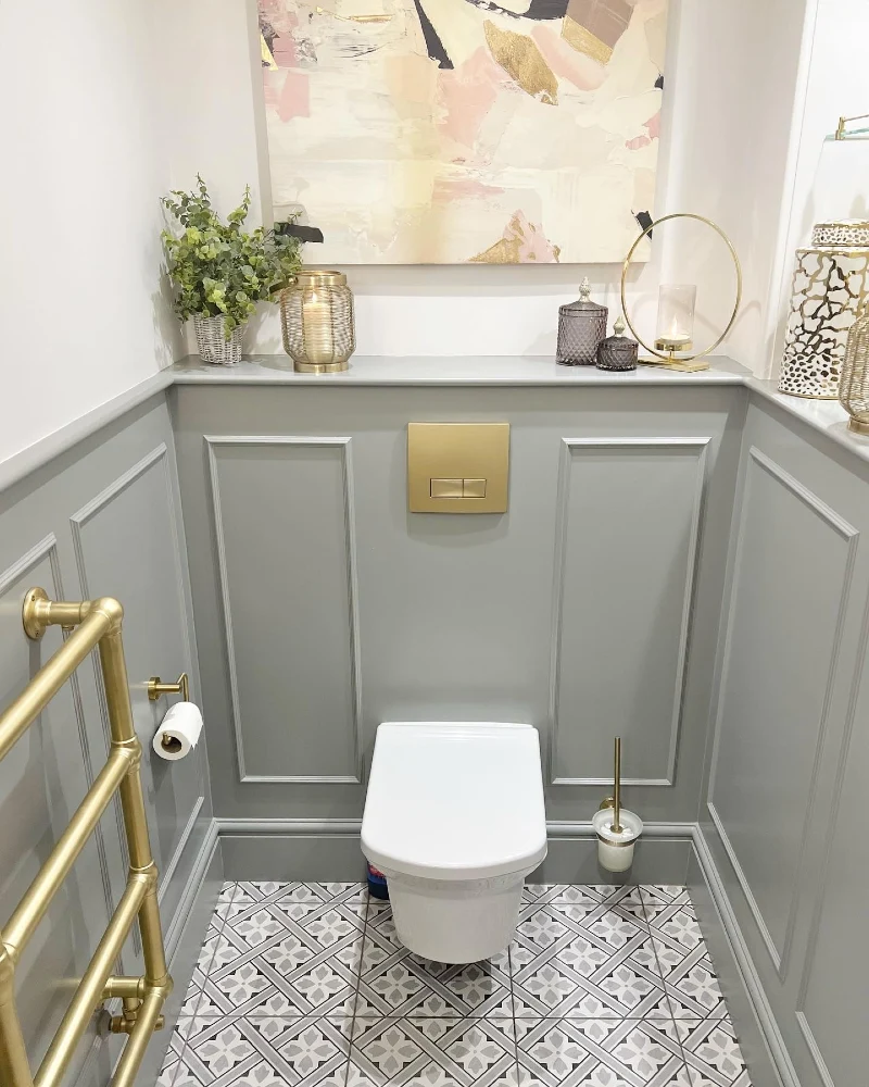 Gray Wainscoting Ledge with Abstract Art and Brass Accents