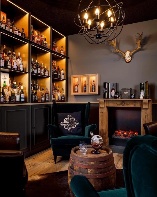 Green Velvet Wingback by a Whiskey Fireplace