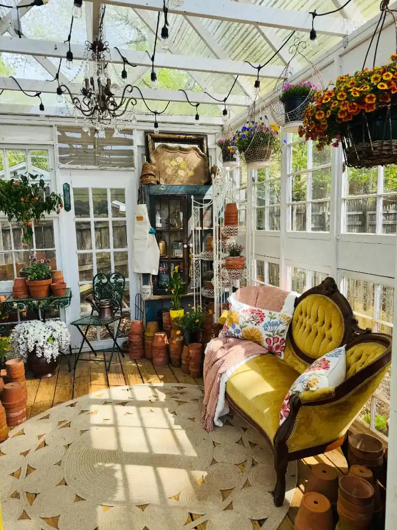 Greenhouse Sunroom with Chartreuse Velvet Settee and Terra-Cotta Pots