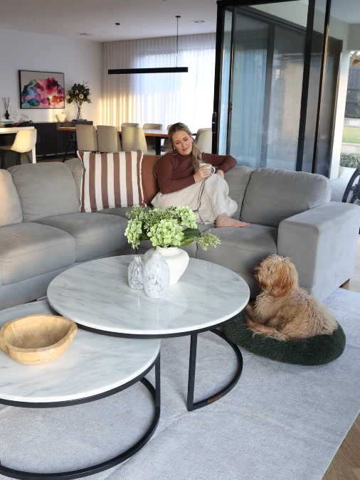 Grey Sectional And A Forest Green Dog Bed Keep Fur In Its Place