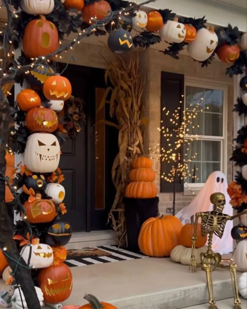 Illuminated Pumpkin Archway with Dried Cornstalks and Classic Front Porch Ghoul