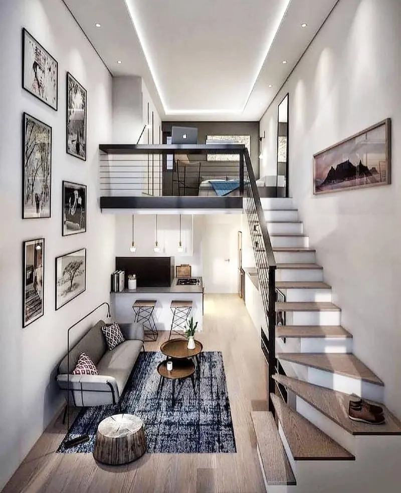 Indigo patterned rug with high gallery wall and recessed linear ceiling glow