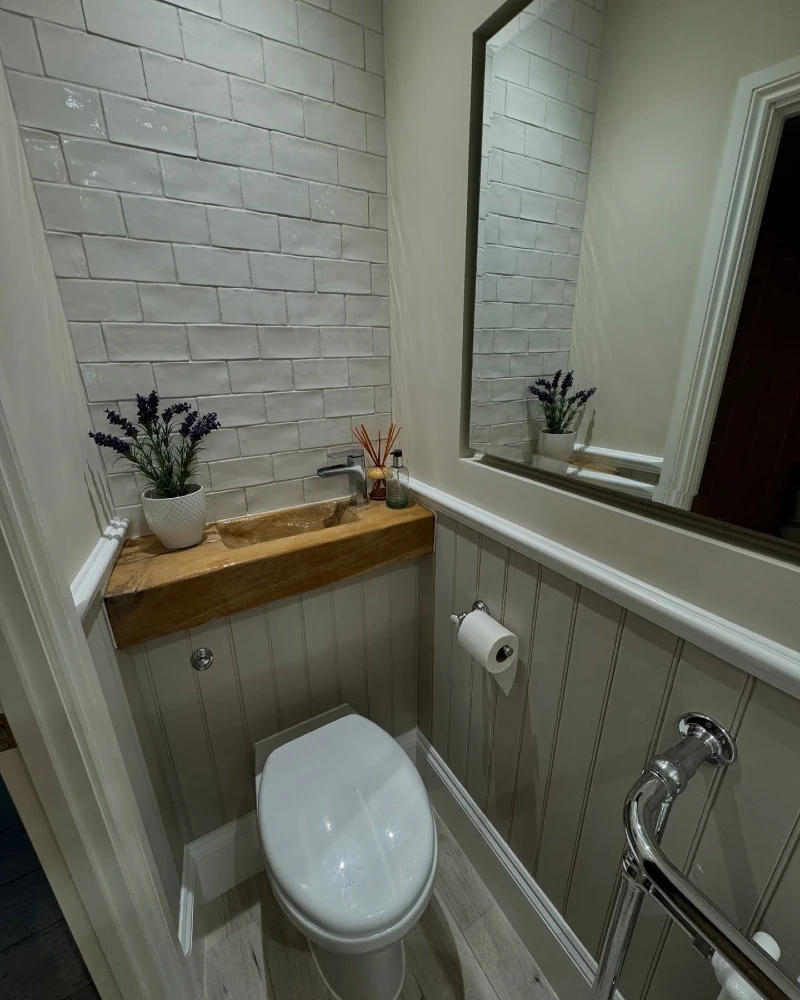 Integrated Wood Vanity Ledge with Glossy Subway Tile Backsplash