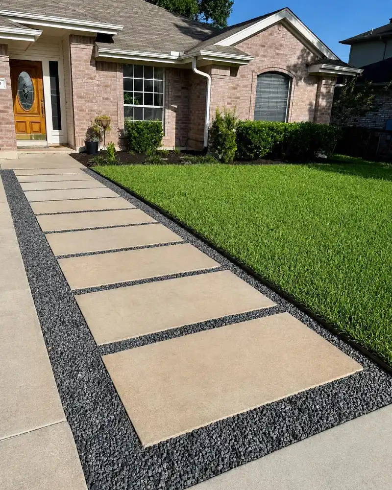 Large Concrete Stepping Slabs with Dark Gravel Borders