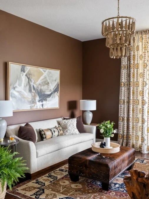 Light Seating And Patterned Drapes Brighten Matte Brown Walls