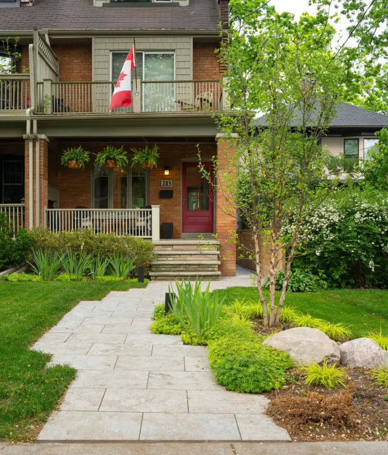 Light Stone Walkway with Layered Greenery and Natural Garden Borders