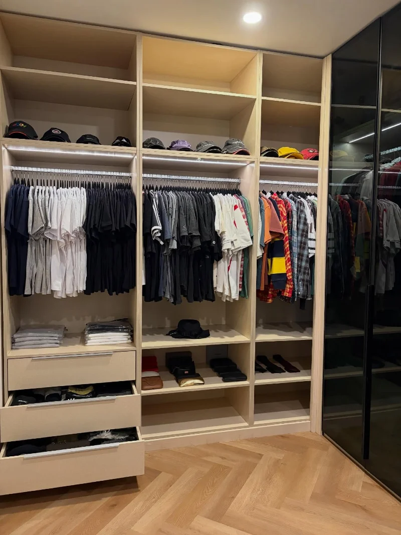 Light Wood Closet with Dedicated Accessory Zones and Smoked Glass Cabinetry