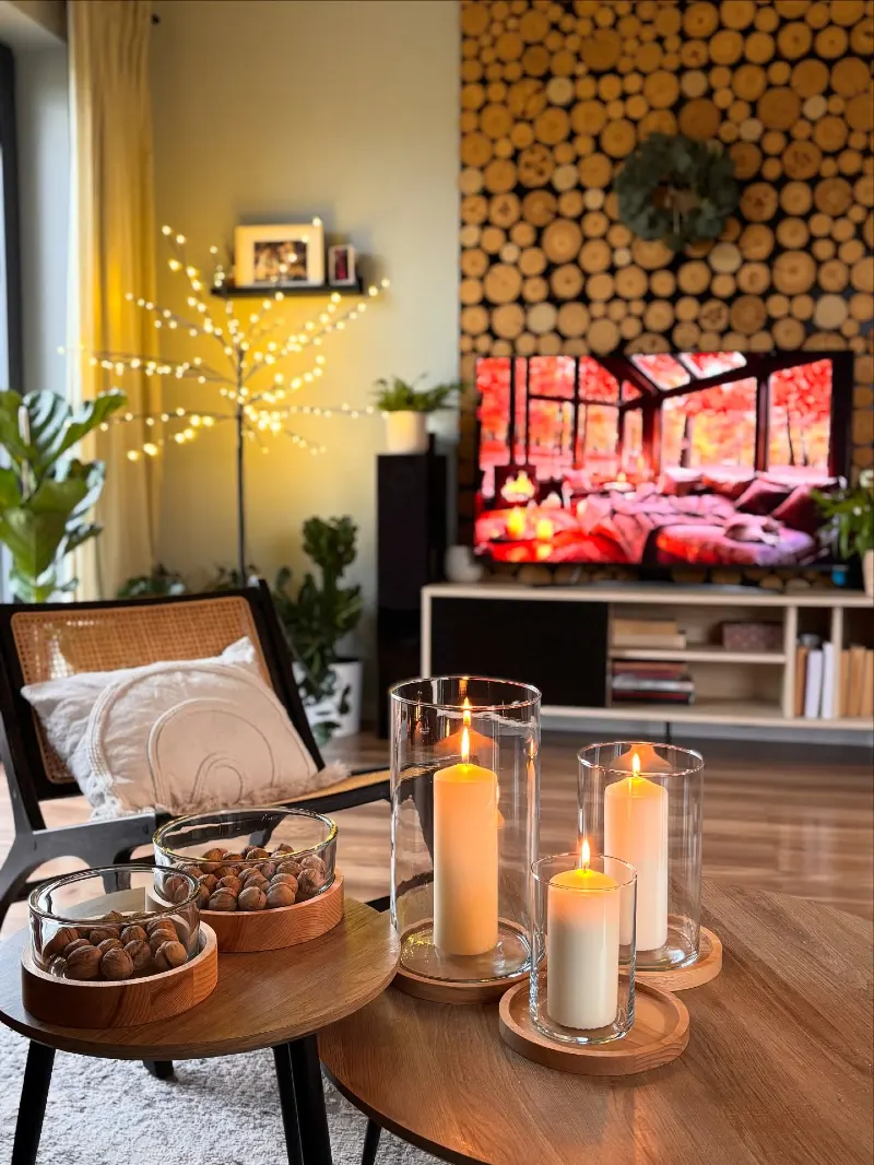 Log-Wall Feature with Pillar Candles and Walnut Bowls