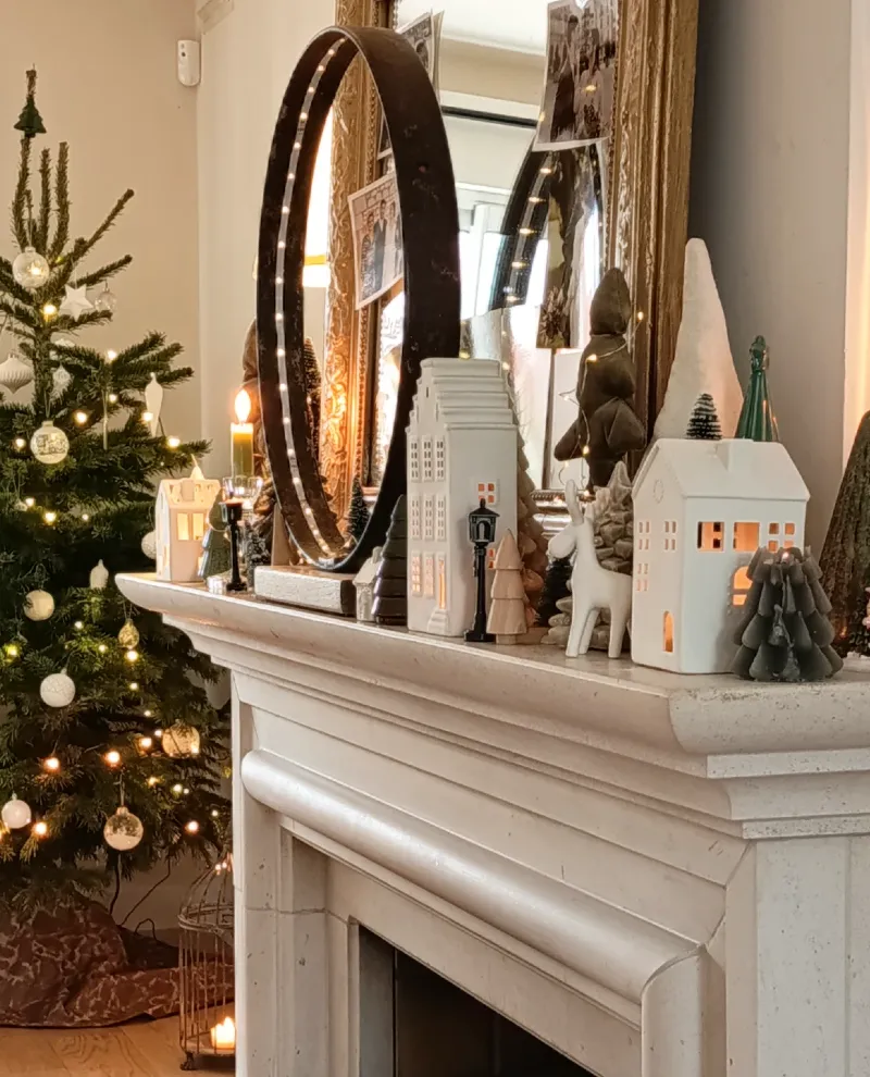 Mantle Village with Circular Lighted Mirror and Decorated Christmas Tree
