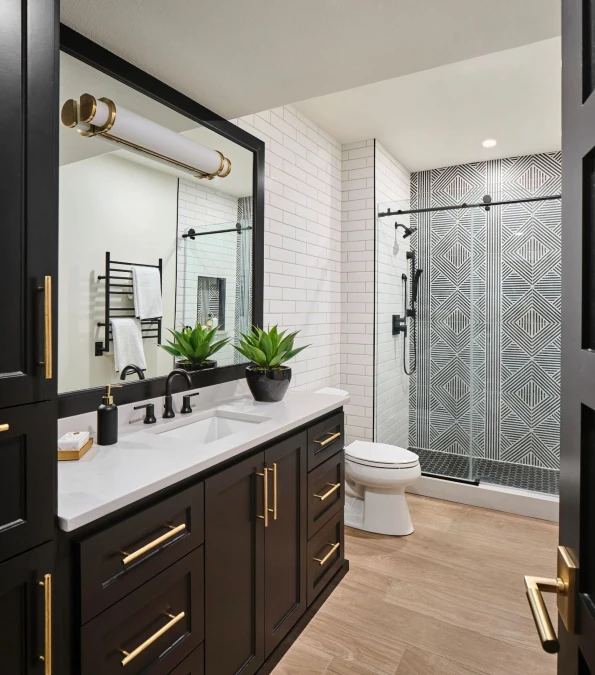 Matte Black Cabinets and Geometric Shower Tiles