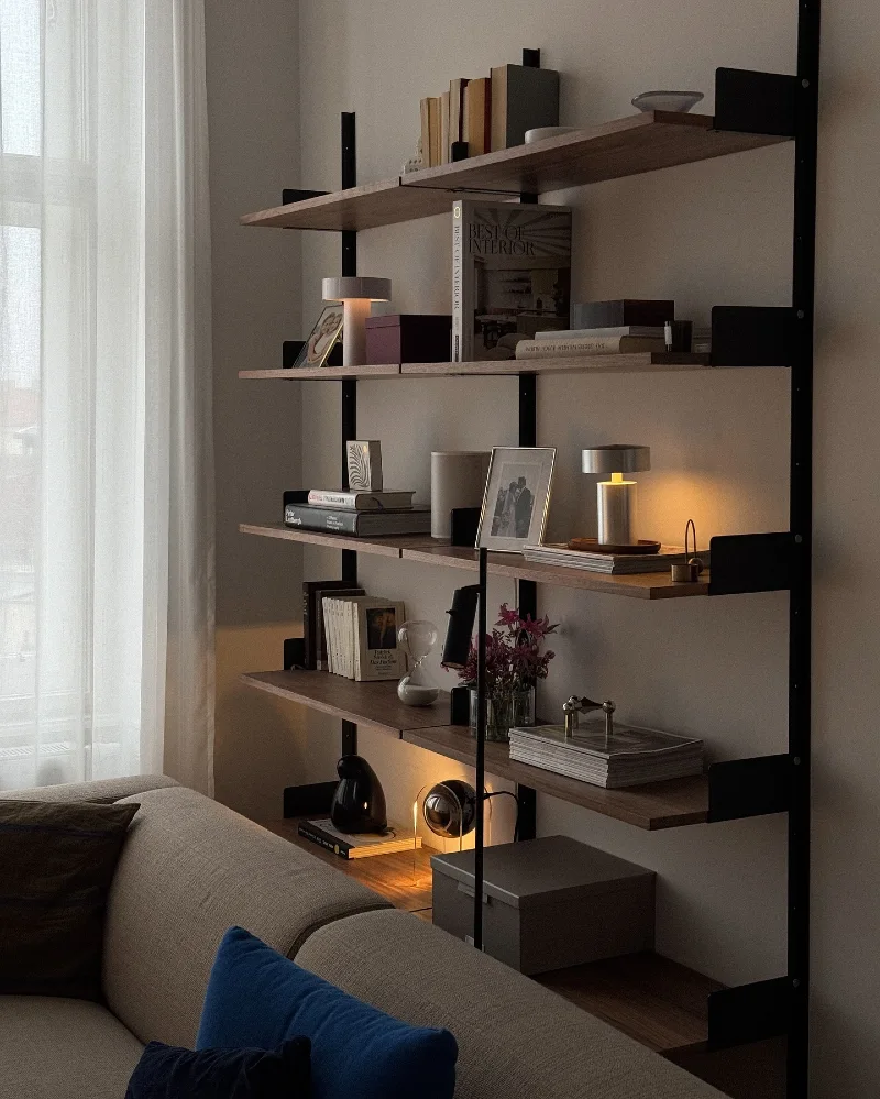 Matte Black Metal Shelving with Warm Task Lamps