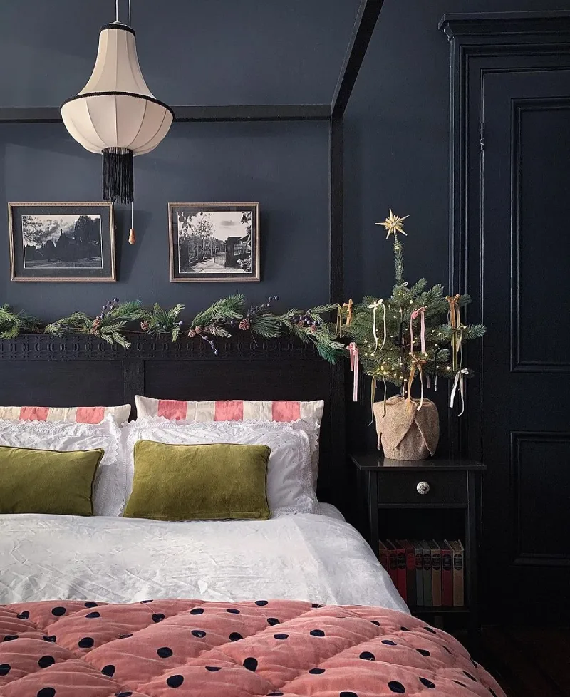 Matte Navy Walls with Ribbon-Tied Tabletop Tree and Olive Velvet Cushions