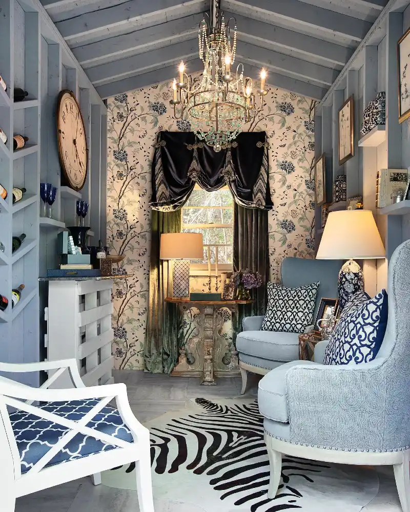 Maximalist Blue Lounge with Floral Wallpaper and Beaded Chandelier