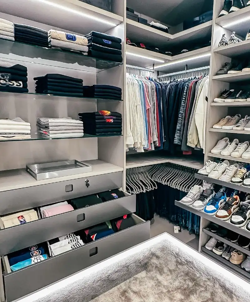 Minimalist Grey Walk-In Closet with Open Shelving and Deep Drawers