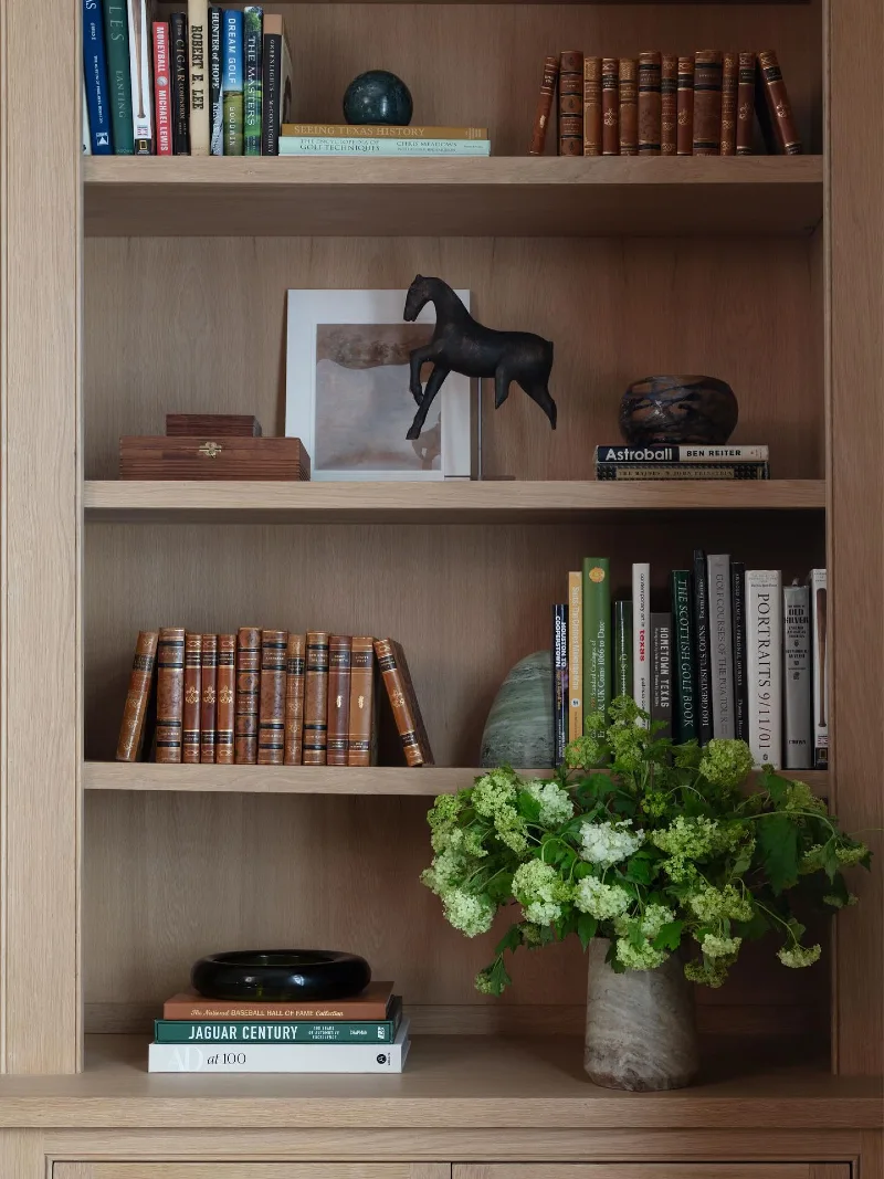 Natural Oak Shelving with Classical Equestrian Elements